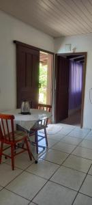 a kitchen with a table and a tea kettle on it at Espaço da paz in Joinville