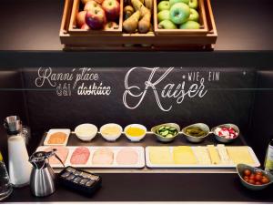 a counter with different types of food on it at B&B Hotel Böblingen in Böblingen