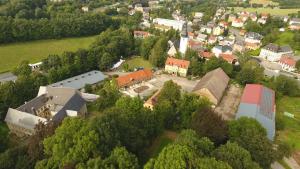 an aerial view of a small town with buildings and trees at Schlaffass in Neumark