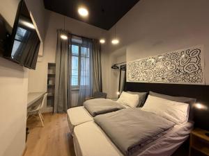 a bedroom with a bed in a room at THE DESIGNER HIDE OUT - Casa Vacanze in Turin