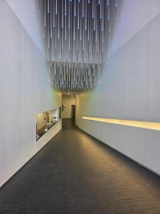 a hallway of a building with lights hanging from the ceiling at Birmingham Central NewStreet 1Bed in Birmingham