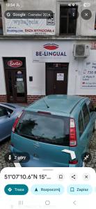 a blue van parked in front of a store at Baza wypadowa 4 in Lubań