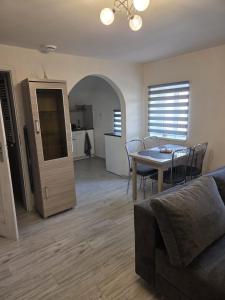 a living room with a couch and a table at Baza wypadowa 4 in Lubań