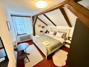 a small bedroom with a bed and a window at Chata Amálka in Rokytnice nad Jizerou