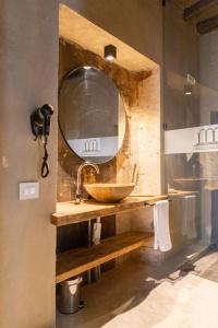 a bathroom with a sink and a mirror at Dimora Del Teatro in Vigevano +30 photos