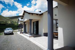 a car parked in front of a house at Bernliz Guest House in Bokong