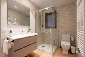 a bathroom with a shower and a sink and a toilet at Modern apartments in one building, in the heart of Girona in Girona +148 photos