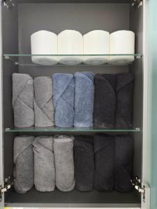 a closet filled with towels and toilet paper at Haven 10 HOUSE in Seoul +52 photos