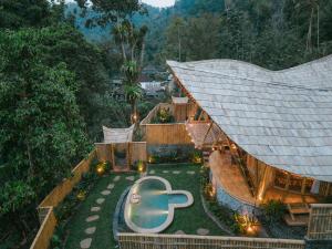 an aerial view of a house with a swimming pool at Sunrise Hill Bamboo House-Private Jungle Villa in Sidemen