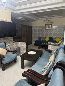 a living room with a couch and a table at Tranquility In the Center of Fez in Fez