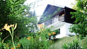 a white house with a black roof at Kuća za odmor Trnac in Tuhelj