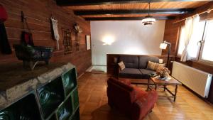 a living room with a couch and a table at Kuća za odmor Trnac in Tuhelj