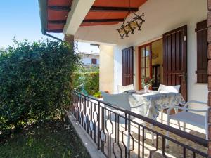 a patio with a table and chairs on a balcony at Villa Patrizia by Interhome in Forte dei Marmi