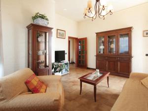 a living room with a couch and a coffee table at Villa Patrizia by Interhome in Forte dei Marmi