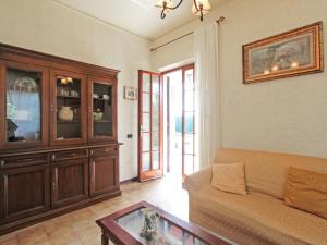 a living room with a couch and a table at Villa Patrizia by Interhome in Forte dei Marmi