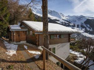 a house with snow on the roof of it at Chalet 5 Ecorces by Interhome in Verbier