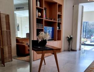 a living room with a table with flowers on it at Hotel Carlton Nice in Nice +26 photos