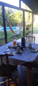 a table with a blue table cloth on it at Le Clos La Perdiz in Pigüé