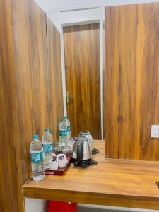 a counter with two bottles of water on top of it at MADHUBAN STAYS rishikesh in Rishīkesh