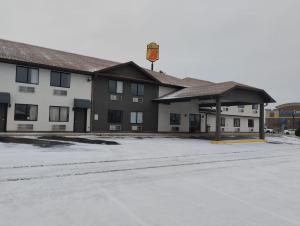 an empty parking lot in front of a hotel at Super 8 by Wyndham Morris in Morris