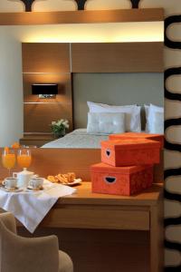 מיטה או מיטות בחדר ב-Elektra Hotel & Spa