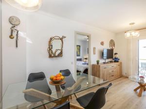a dining room with a glass table and chairs at Apartment Platja Mar by Interhome in L'Escala