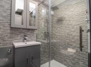 a bathroom with a sink and a glass shower at The Cabin - Private Car Park with CCTV - Fast WiFi - Peaceful Retreat with Views for Business or Couples in Oldbury +26 photos