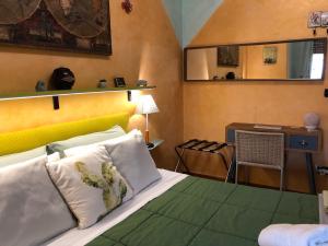 a bedroom with a bed and a desk with a desk at Rizzi Marianna B&B in Monopoli