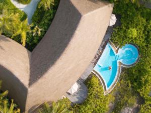 an overhead view of a pool at a resort at SO/ Maldives in South Male Atoll +213 photos