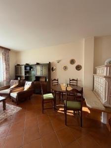 a living room with a couch and a table at Ciasa Caligher in Venas