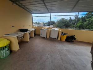 a bathroom with three sinks and a sink at Doña Minda Home in Naiboa