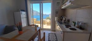 a small kitchen with a view of the ocean at Skalia Mountain Sea Serenity in Kalymnos