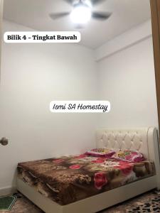 a bedroom with a bed in a room at Ismi SA Homestay in Rawang