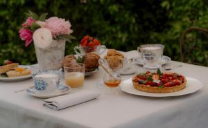 a table with a plate of food on a table at Dimora Tre Galline in Canale