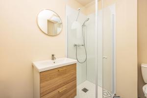 a bathroom with a sink and a shower at Le Figuier - Studio de Charme in Lavaur