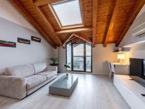 a living room with a couch and a table at Apartment Blu Lake by Interhome in Ghiffa