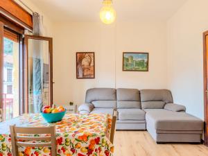 a living room with a couch and a table at Apartment Casa Silvia by Interhome in Carlazzo