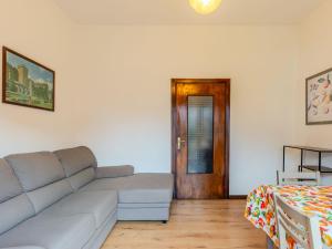 a living room with a couch and a table at Apartment Casa Silvia by Interhome in Carlazzo