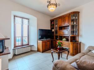 a living room with a couch and a table at Apartment Lakeview Menaggio by Interhome in Menaggio