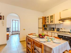 a kitchen and dining room with a table and chairs at Apartment Lakeview Menaggio by Interhome in Menaggio