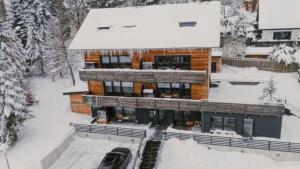 an aerial view of a building in the snow at BergButzen mit Balkon in Braunlage +90 photos