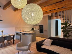 a living room with a couch and a table at JAMY HOUSE Apartmán in Habovka