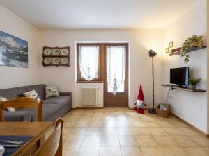 a living room with a santa hat on the door at Apartment The Silent Sylva by Interhome in Isolaccia