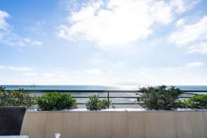 a balcony with a view of the beach at Miramar Whg 513 in Grömitz