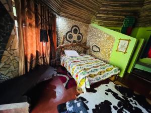 a bedroom with a bed in a room at Oldadai Falls Retreat in Arusha