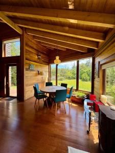 a dining room with a table and chairs at Casa Arrayan in Puerto Varas
