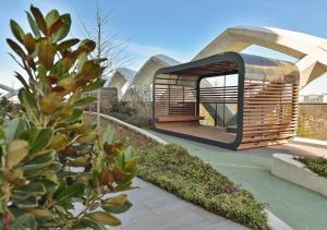 a rendering of a building with a curved roof at Modern Spaces U-Tower in Tashkent