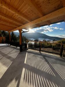 a porch with a wooden roof with a view at Apartment Vlasic in Šišava