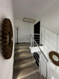a staircase with a metal railing and a spiral stair case at Apartment Vlasic in Šišava