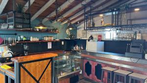 a large kitchen with a bar in a restaurant at RIA Terrace in Faro